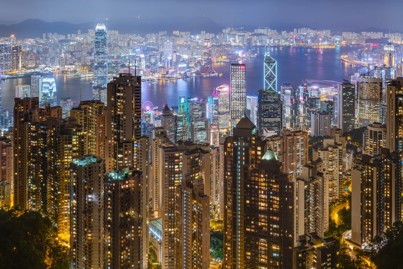 Hong Kong skyline and Victoria Harbour illuminated at night